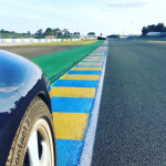 Porsche driving on a race track